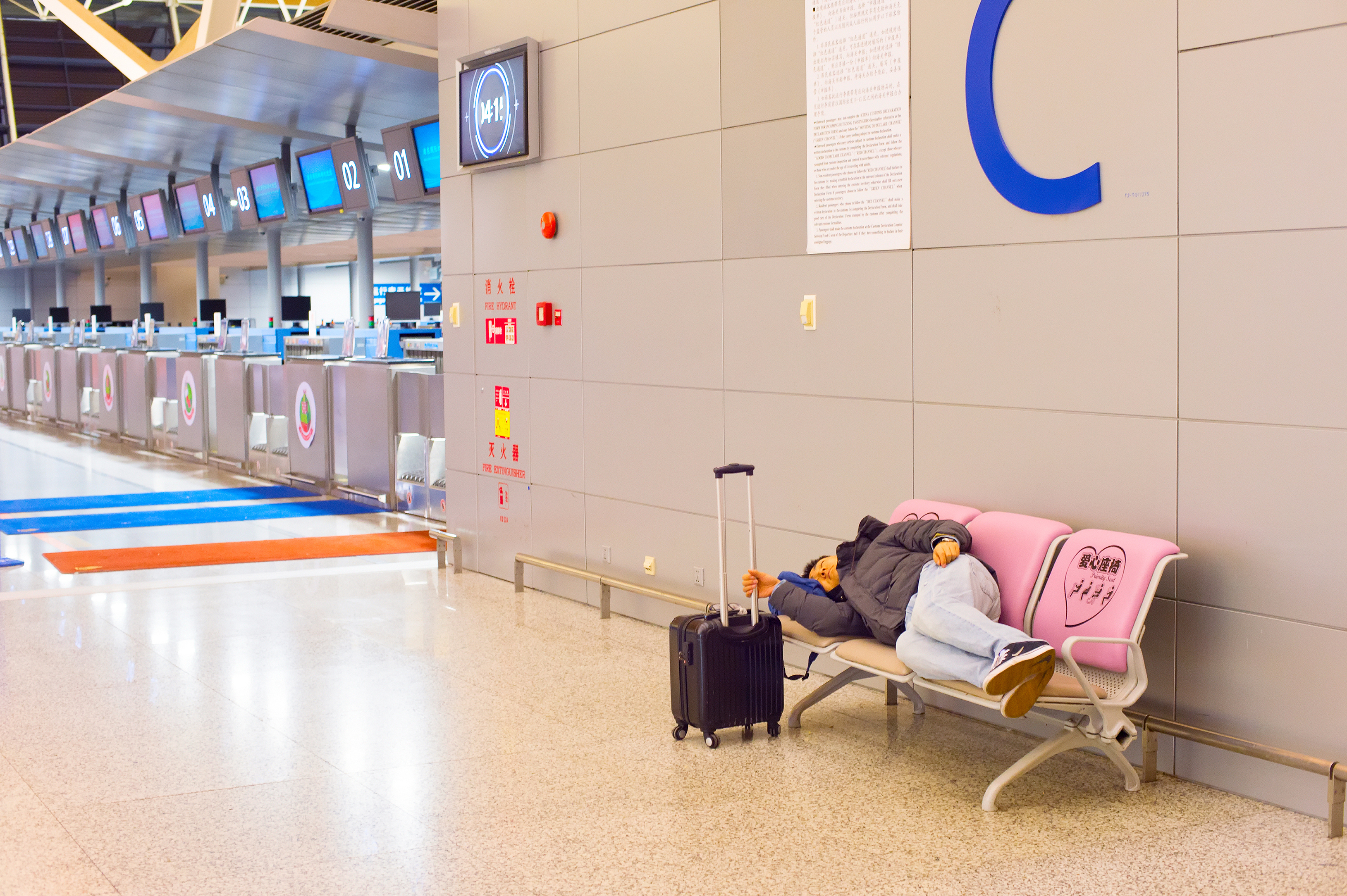 sleeping passenger in train station